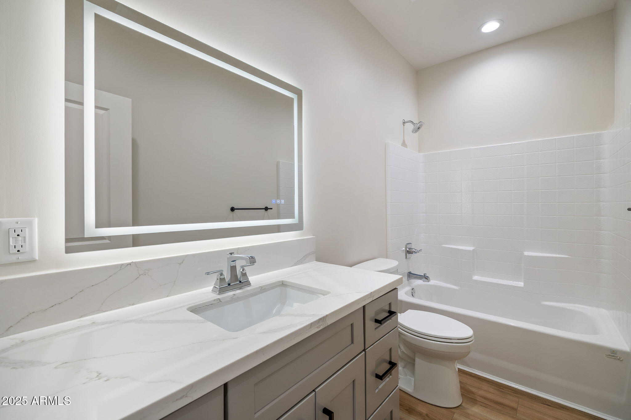 855 10th South St. Johns, AZ 85936 - Photo 31 of 41 a bathroom with a granite countertop sink a toilet and a bathtub