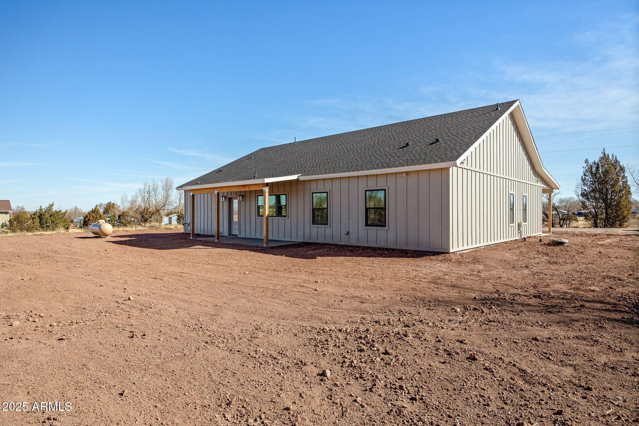 855 10th South St. Johns, AZ 85936 - Photo 37 of 41 a view of house with backyard and bushes
