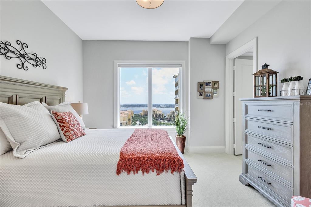 140 Riviera Dunes Way, Unit 1203 Palmetto, FL 34221 - Photo 20 of 30 a bedroom with a bed and a window