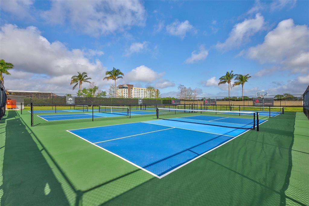 140 Riviera Dunes Way, Unit 1203 Palmetto, FL 34221 - Photo 28 of 30 a view of an outdoor space and tennis court