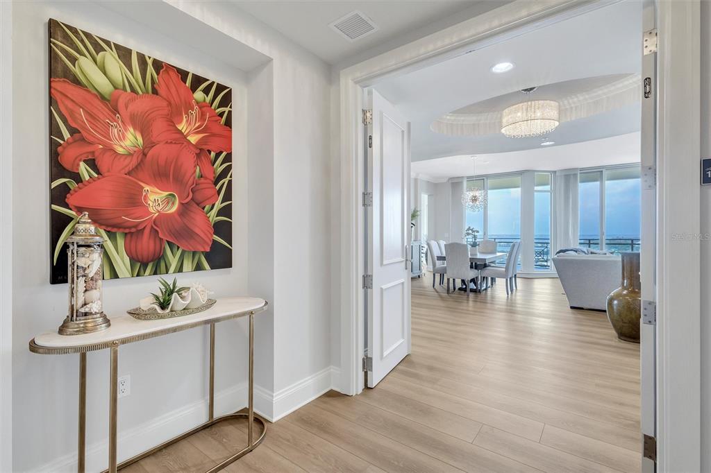 140 Riviera Dunes Way, Unit 1203 Palmetto, FL 34221 - Photo 4 of 30 a living room with furniture and wooden floor