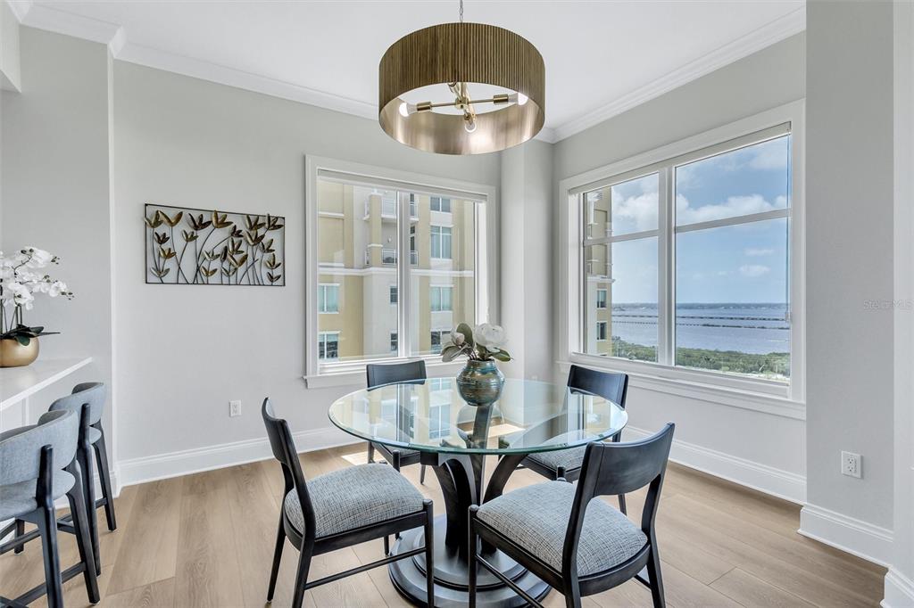 140 Riviera Dunes Way, Unit 1203 Palmetto, FL 34221 - Photo 7 of 30 a view of a dining room with furniture window and wooden floor