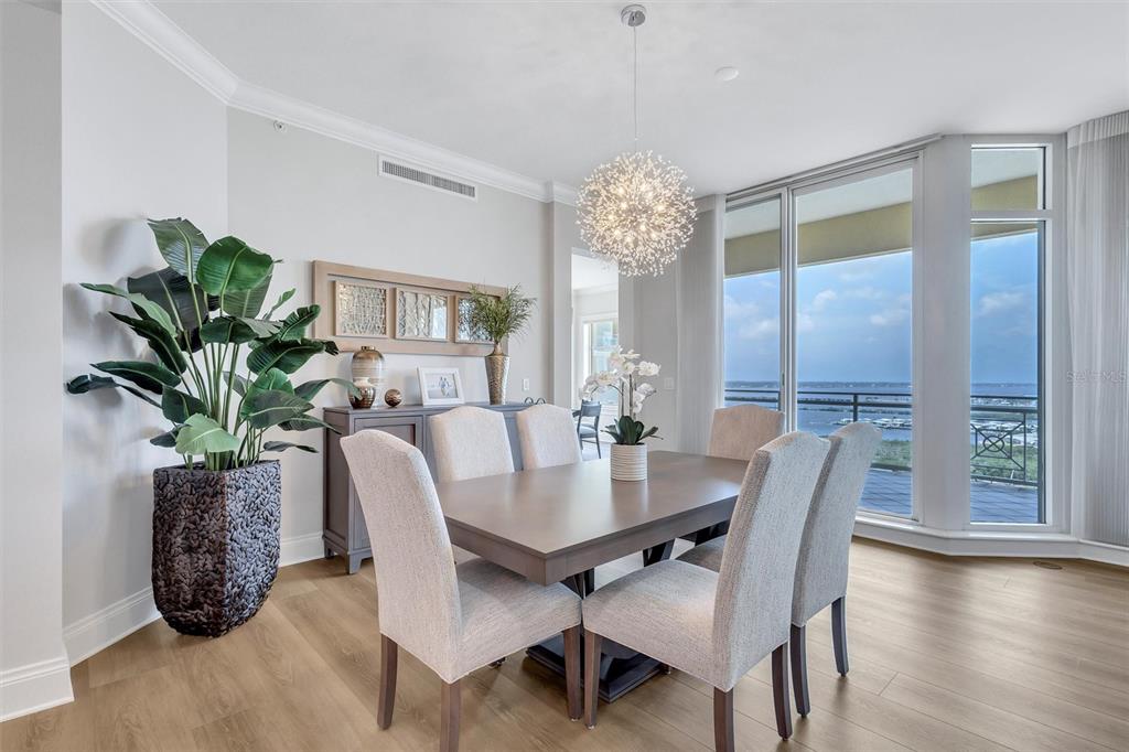 140 Riviera Dunes Way, Unit 1203 Palmetto, FL 34221 - Photo 8 of 30 a view of a dining room with furniture window and wooden floor