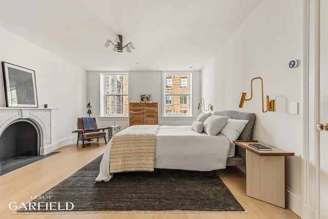 a bedroom with a large bed and a couch