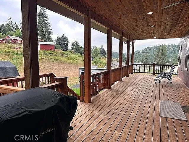 a view of a balcony with wooden floor
