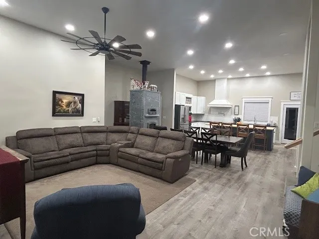 a living room with furniture and kitchen view