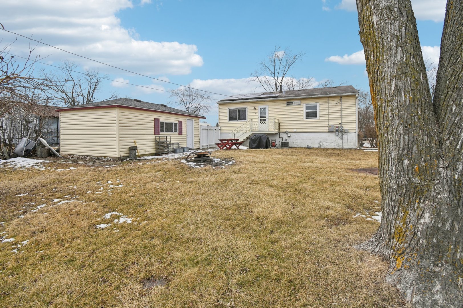 703 Sunset Circle Streamwood, IL 60107 - Photo 18 of 22 a view of a house with a yard