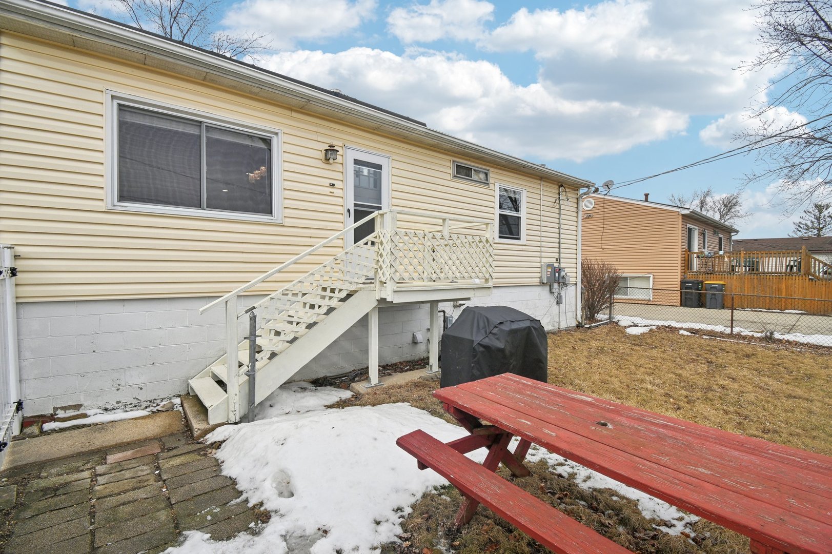 703 Sunset Circle Streamwood, IL 60107 - Photo 19 of 22 a view of a house with a patio