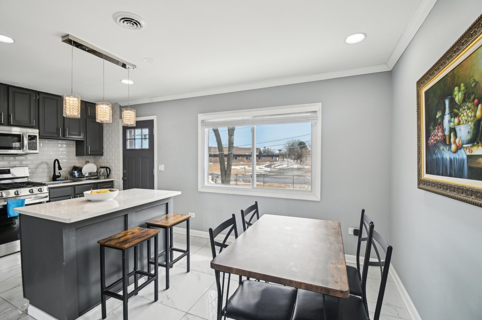 703 Sunset Circle Streamwood, IL 60107 - Photo 4 of 22 a view of a dining room with furniture and a window