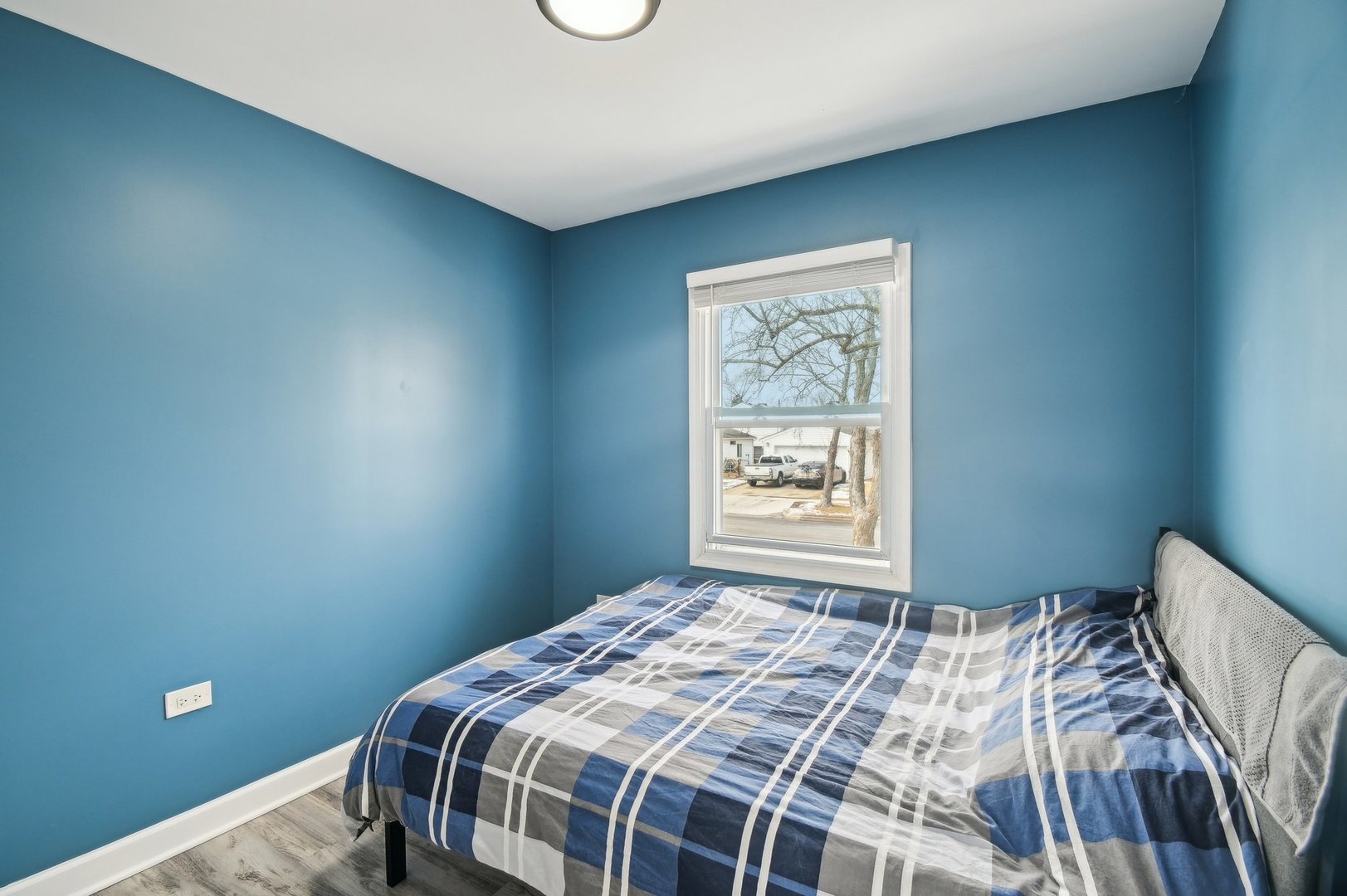 703 Sunset Circle Streamwood, IL 60107 - Photo 8 of 22 a bedroom with a bed and a window