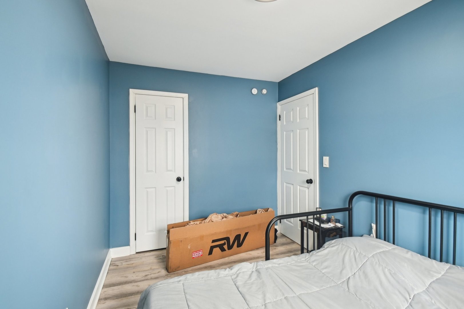 703 Sunset Circle Streamwood, IL 60107 - Photo 9 of 22 a bedroom with a bed and a window