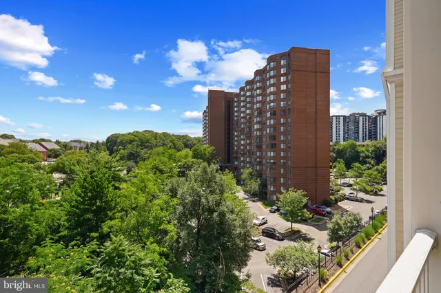 a view of building with yard and staircase