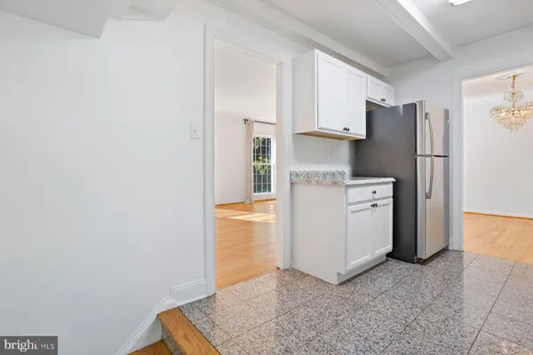 a utility room with cabinets washer and dryer