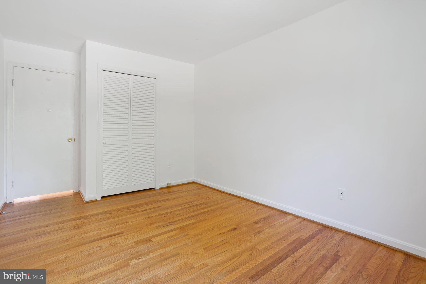 1242 Derbyshire Road Potomac, MD 20854 - Photo 24 of 40 a view of empty room with wooden floor