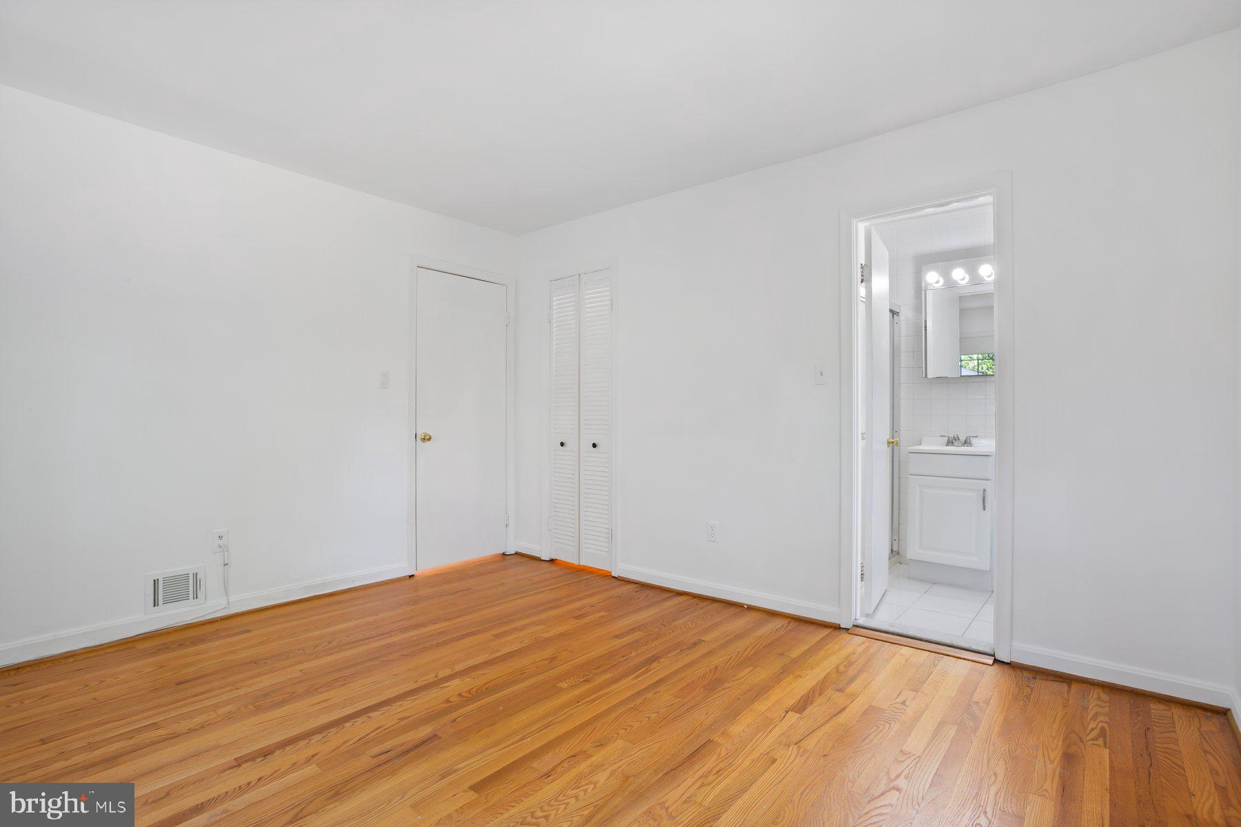 1242 Derbyshire Road Potomac, MD 20854 - Photo 32 of 40 wooden floor in an empty room