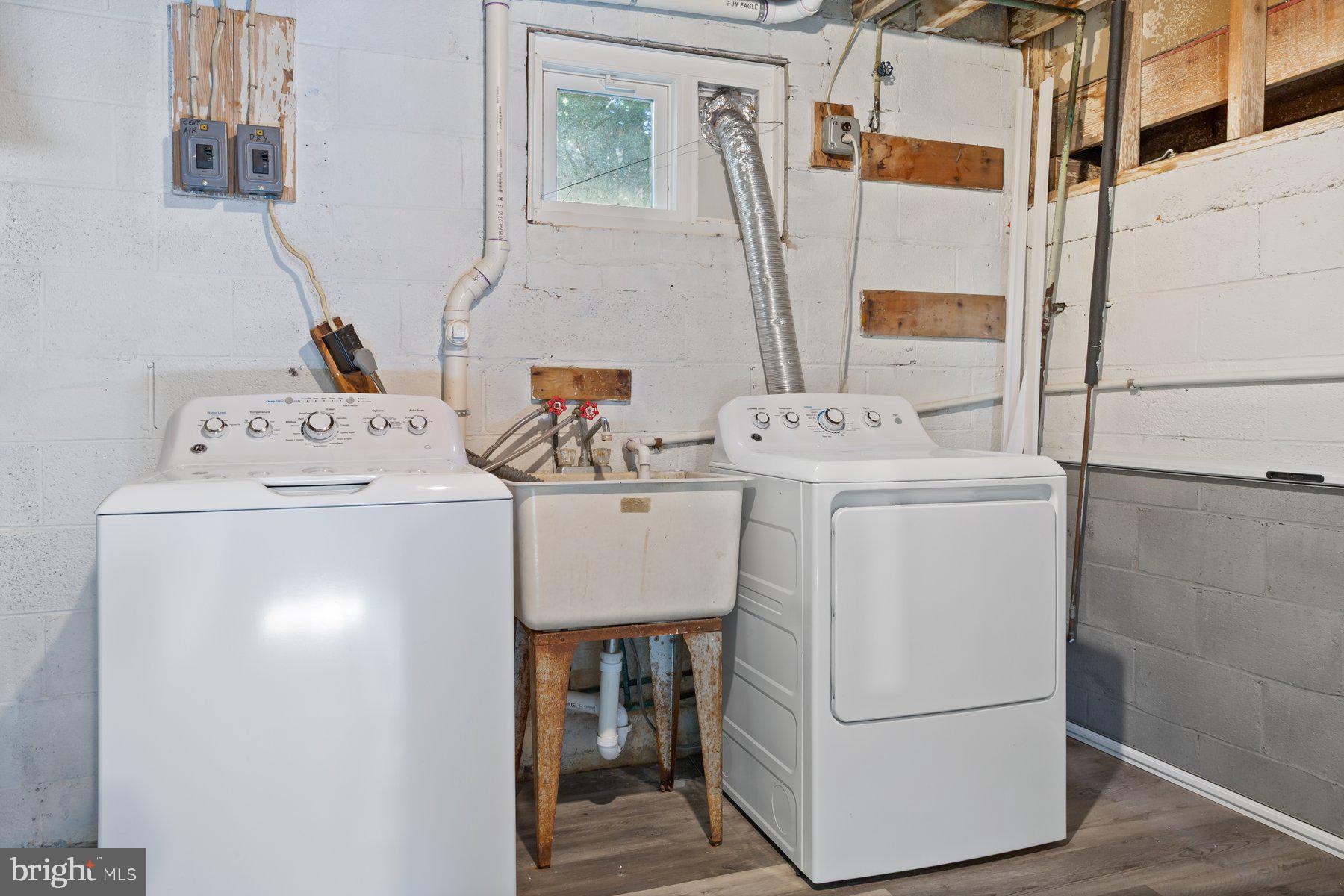 1242 Derbyshire Road Potomac, MD 20854 - Photo 34 of 40 a utility room with dryer and washer