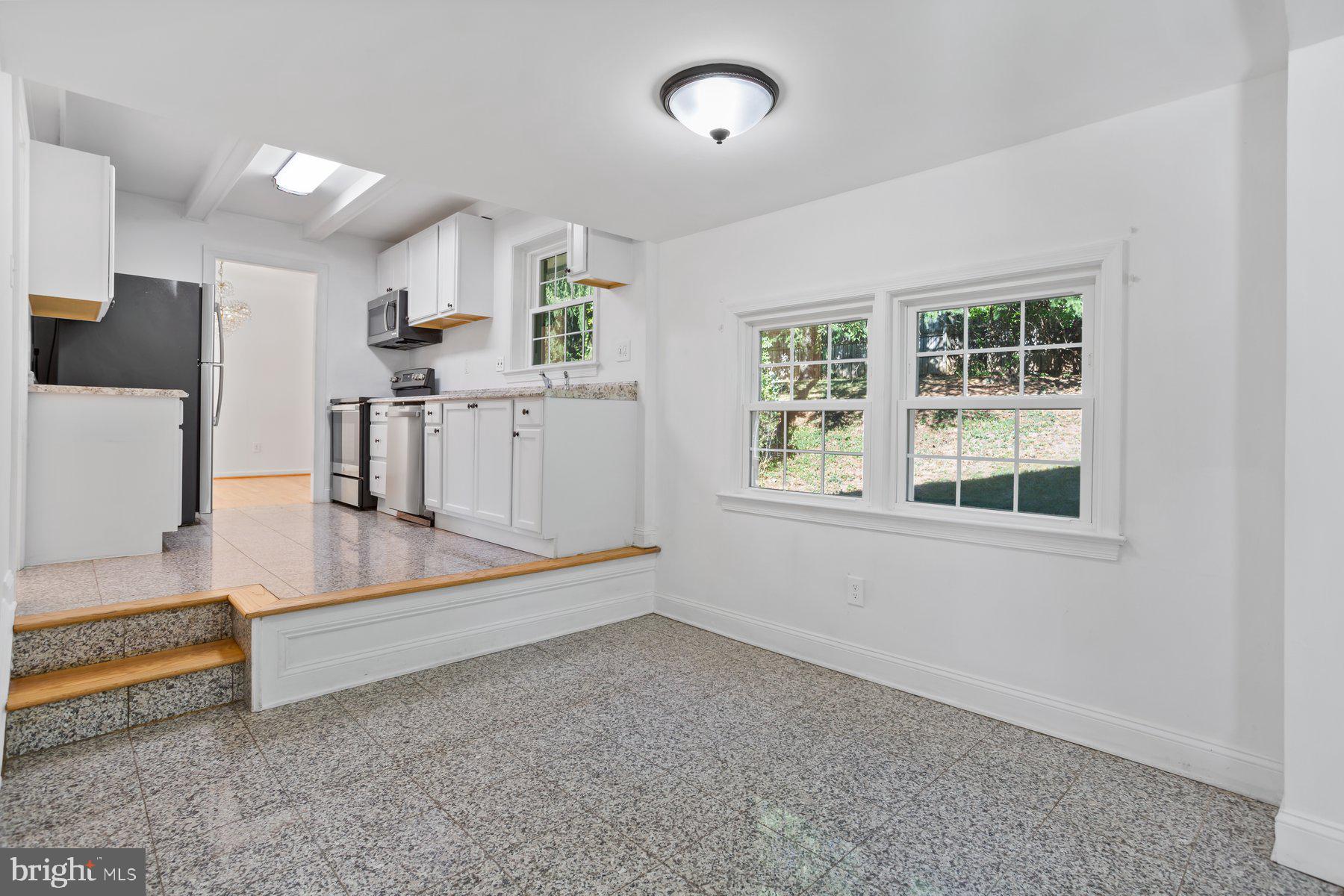 1242 Derbyshire Road Potomac, MD 20854 - Photo 7 of 40 a view of kitchen with furniture and windows