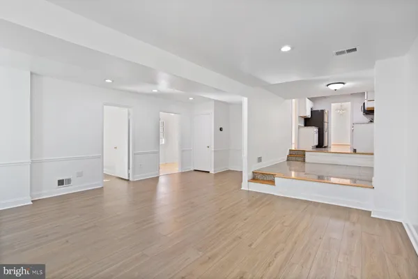 a view of a kitchen with wooden floor