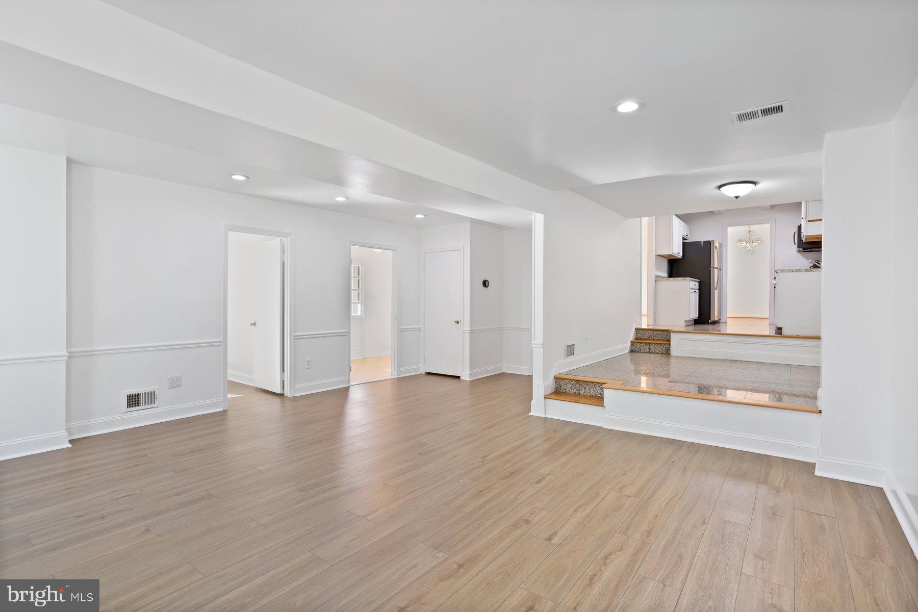 1242 Derbyshire Road Potomac, MD 20854 - Photo 10 of 40 a view of a kitchen with wooden floor