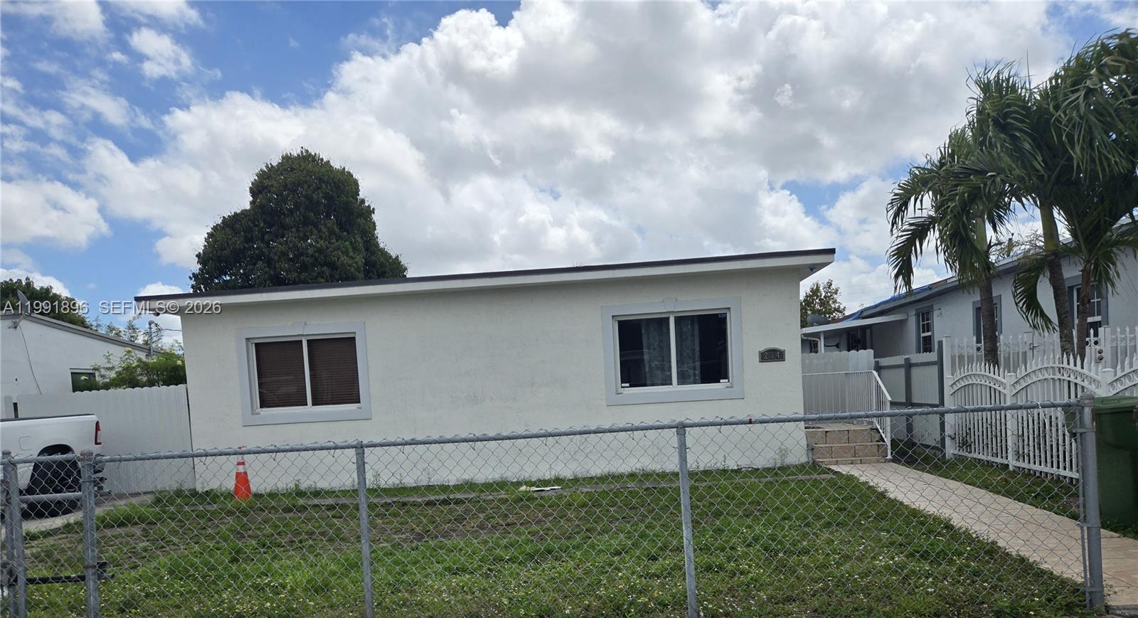 234 East 44th Street Hialeah, FL 33013 - Photo 1 of 14 a backyard of a house with lots of green space
