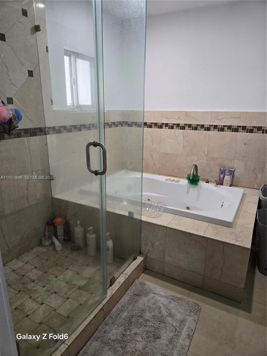 234 East 44th Street Hialeah, FL 33013 - Photo 11 of 14 a bathroom with a sink and mirror
