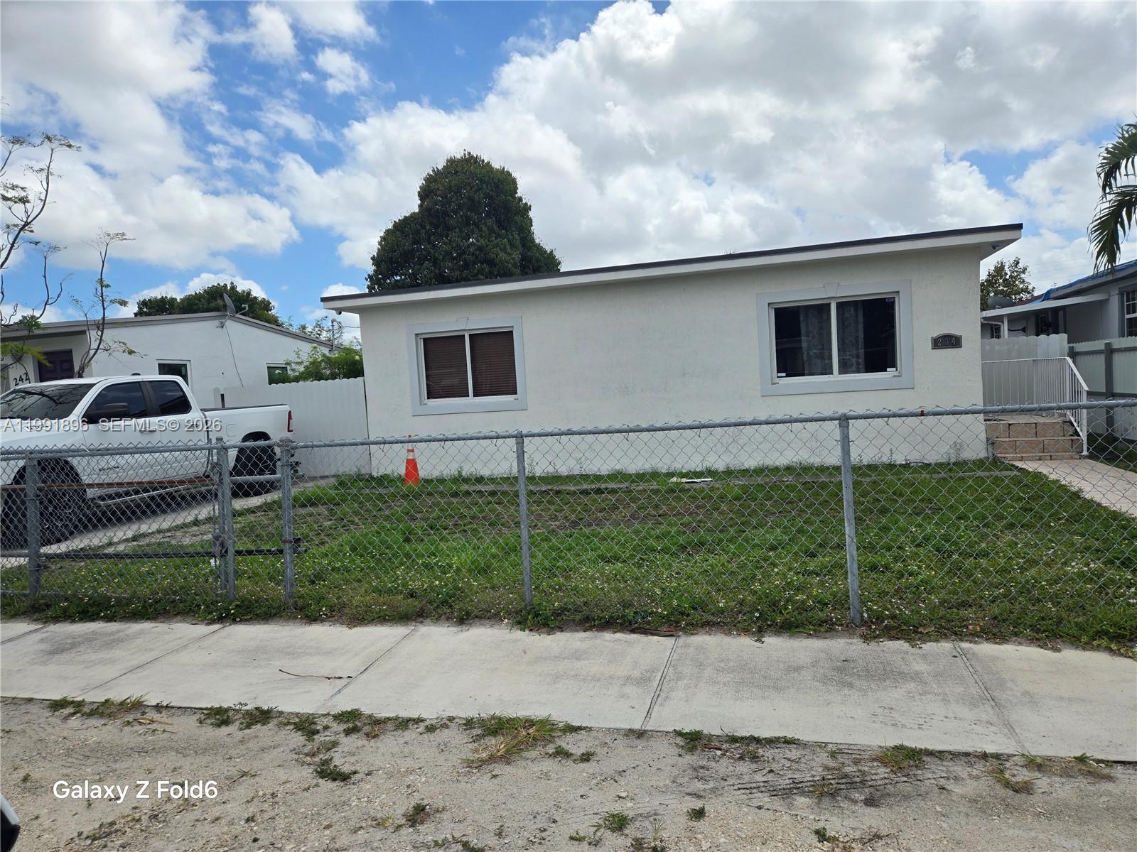 234 East 44th Street Hialeah, FL 33013 - Photo 2 of 14 a house view with a garden space