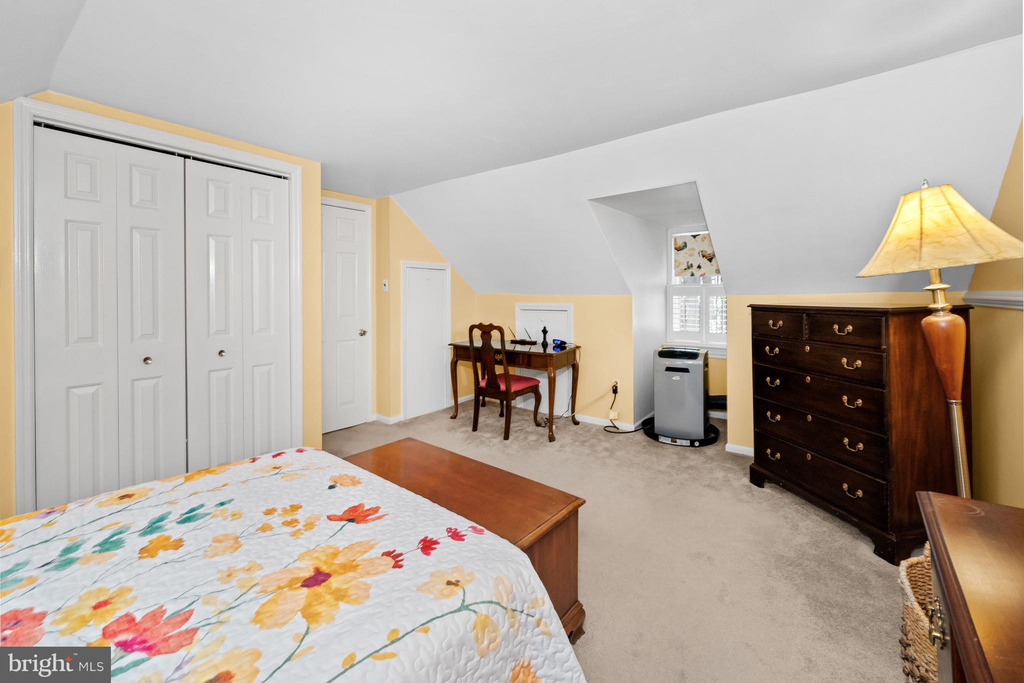 55 Ivy Road Wilmington, DE 19806 - Photo 30 of 38 a bedroom with a bed and a chandelier