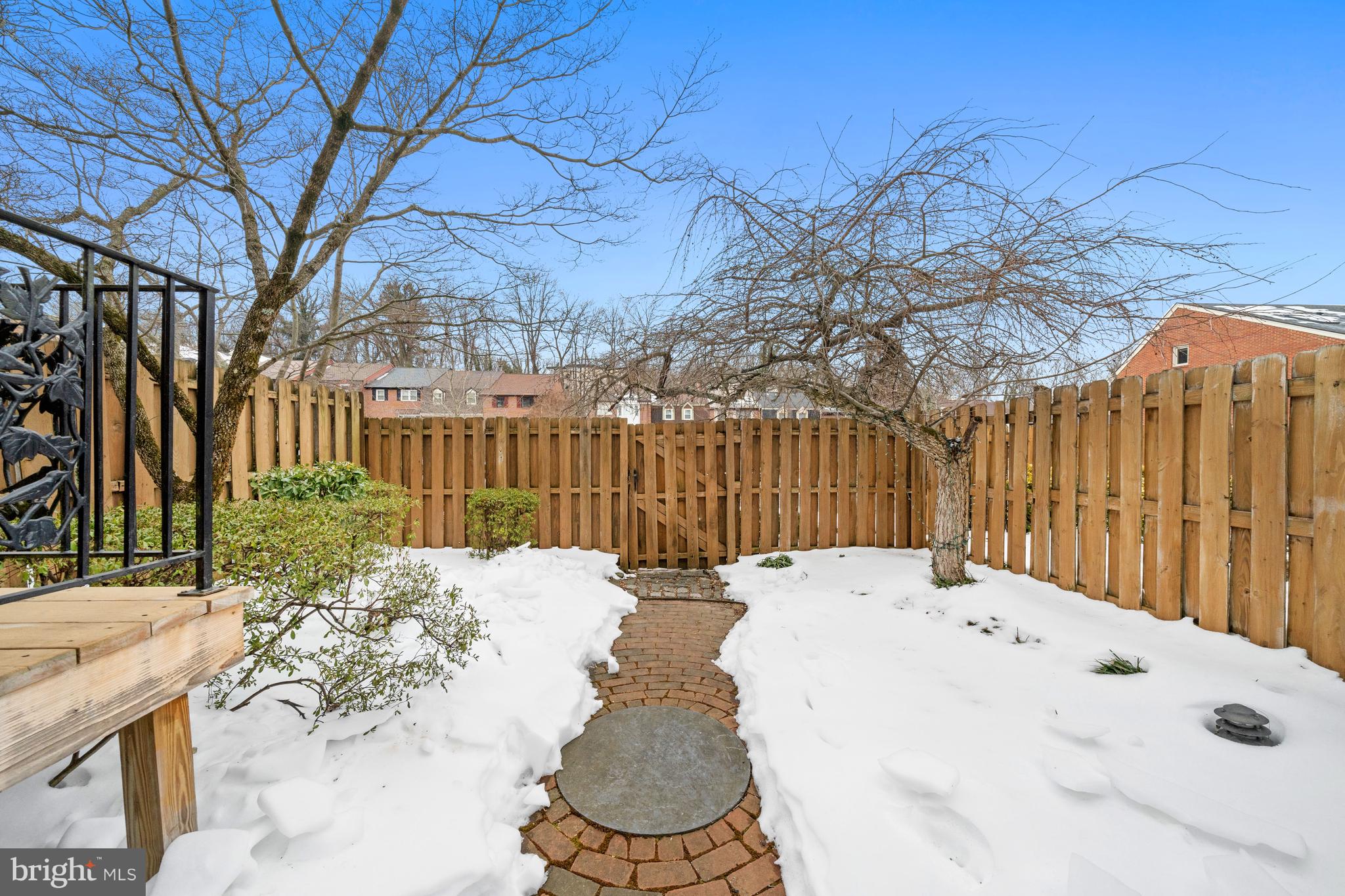 55 Ivy Road Wilmington, DE 19806 - Photo 33 of 38 a view of a backyard with table and chairs with wooden fence