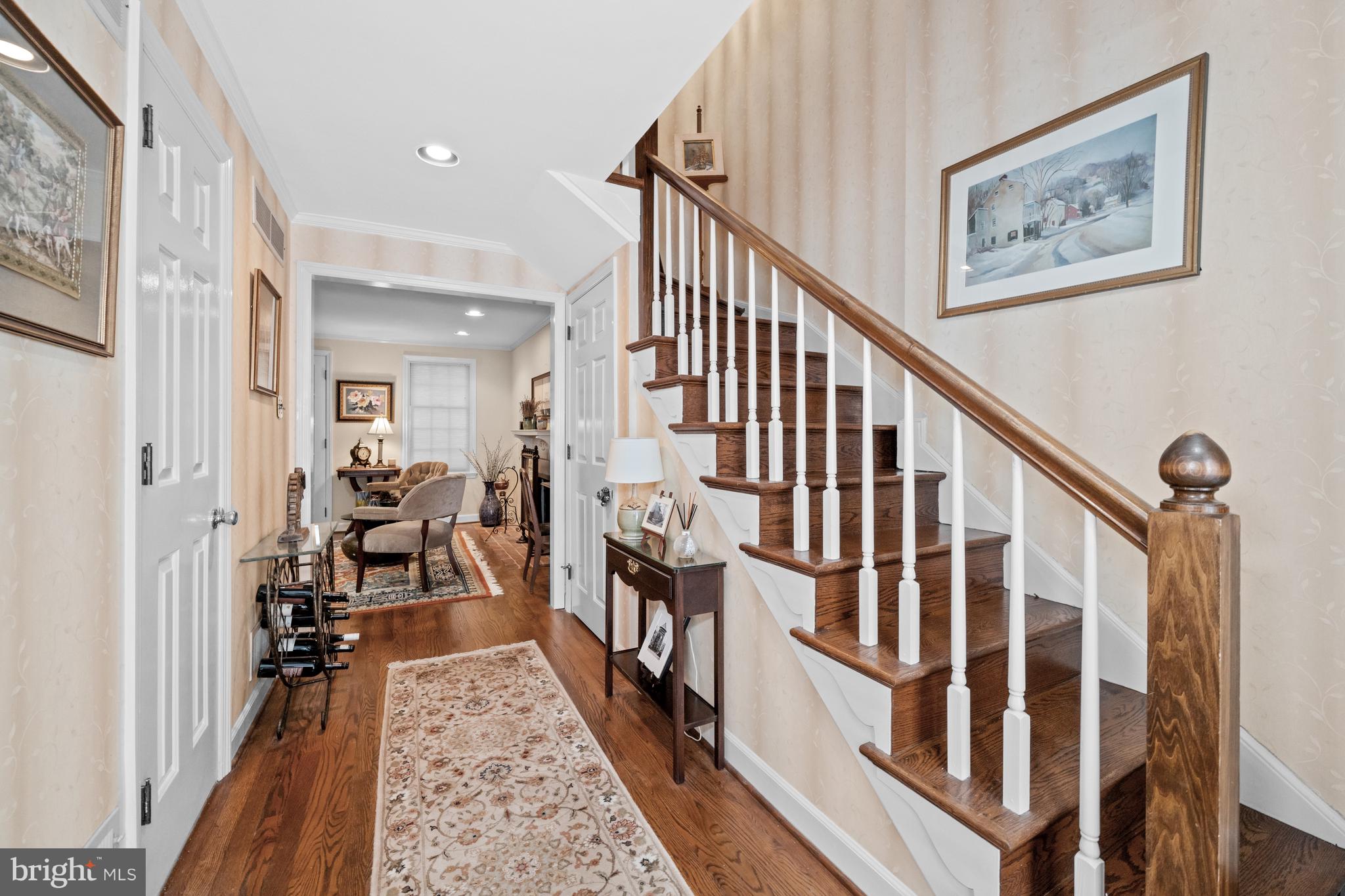 55 Ivy Road Wilmington, DE 19806 - Photo 4 of 38 a view of a hallway with wooden floor and stairs