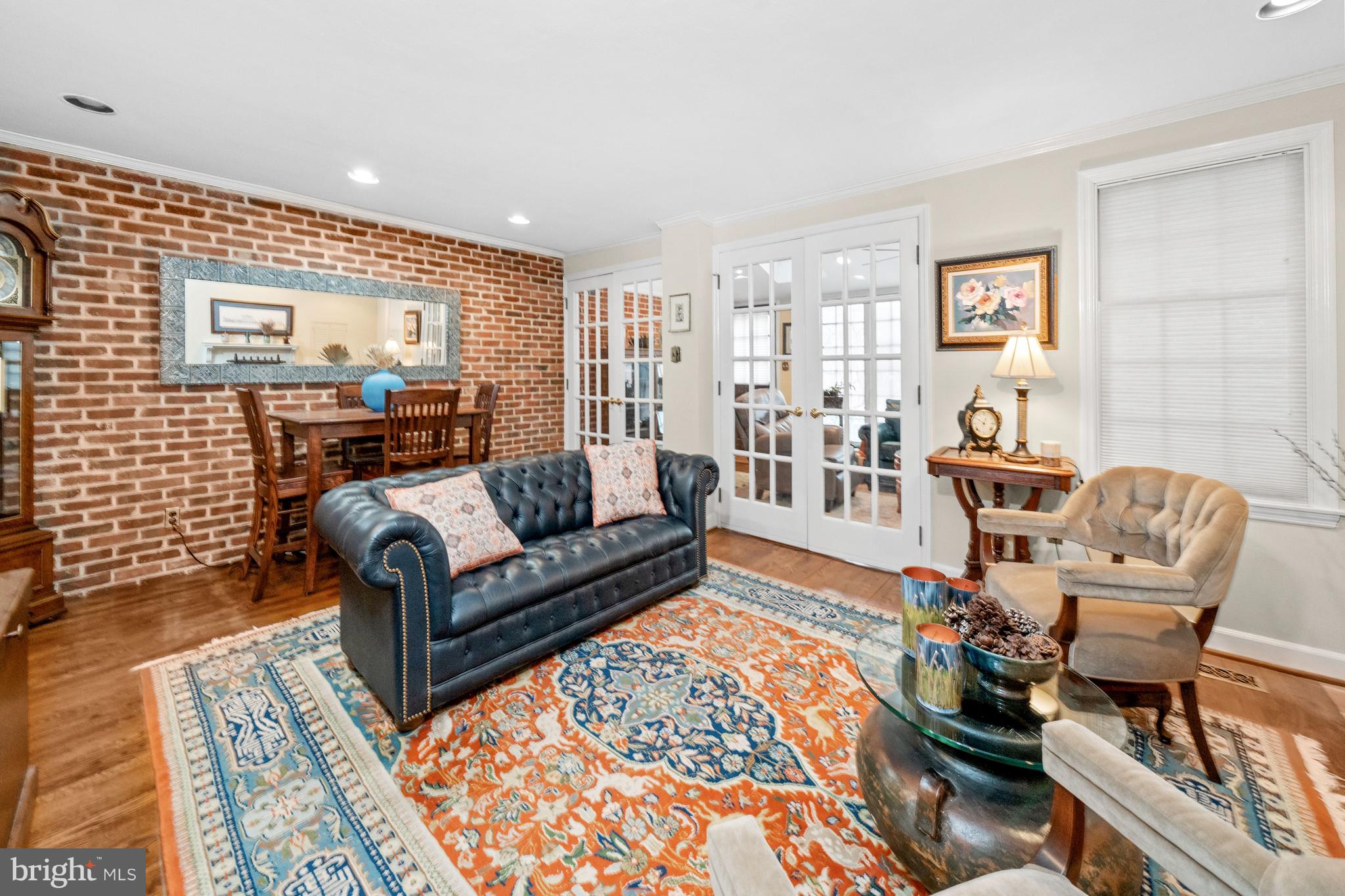 55 Ivy Road Wilmington, DE 19806 - Photo 9 of 38 a living room with furniture and a wooden floor