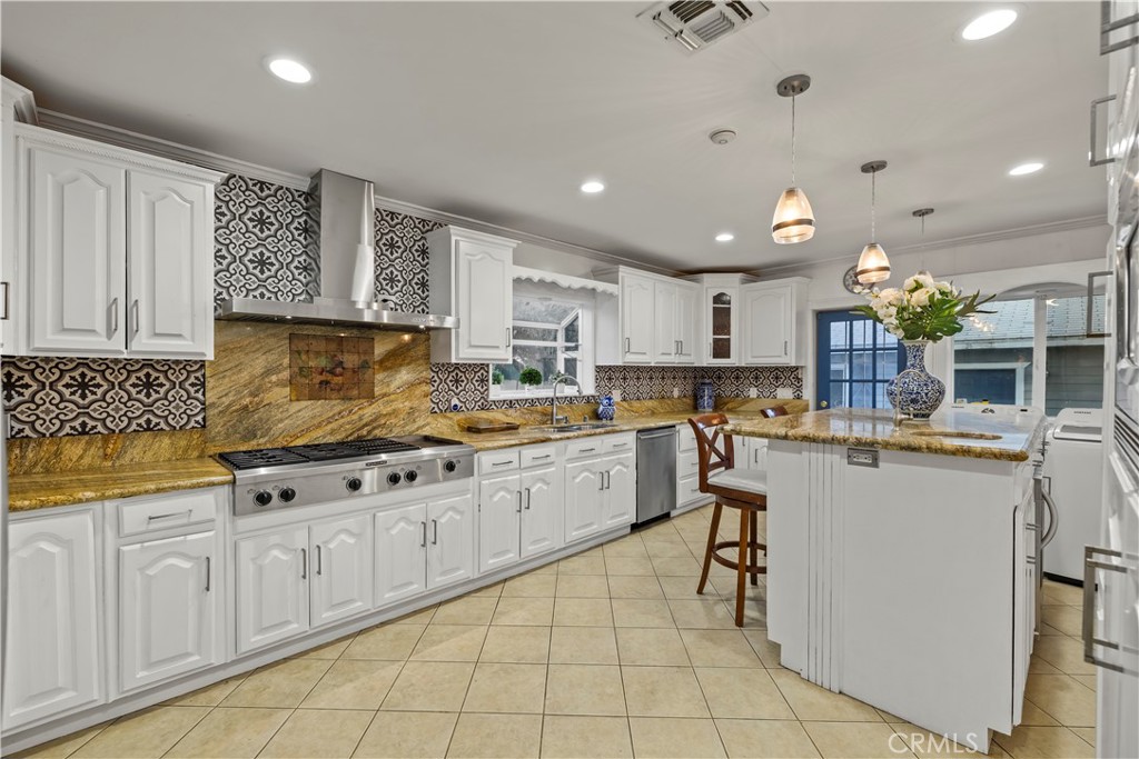 790 North El Molino Avenue Pasadena, CA 91104 - Photo 15 of 34 a kitchen with cabinets and chairs