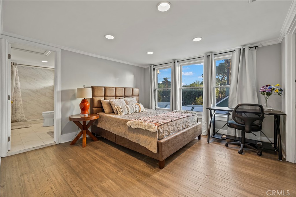 790 North El Molino Avenue Pasadena, CA 91104 - Photo 24 of 34 a bedroom with a bed and a table