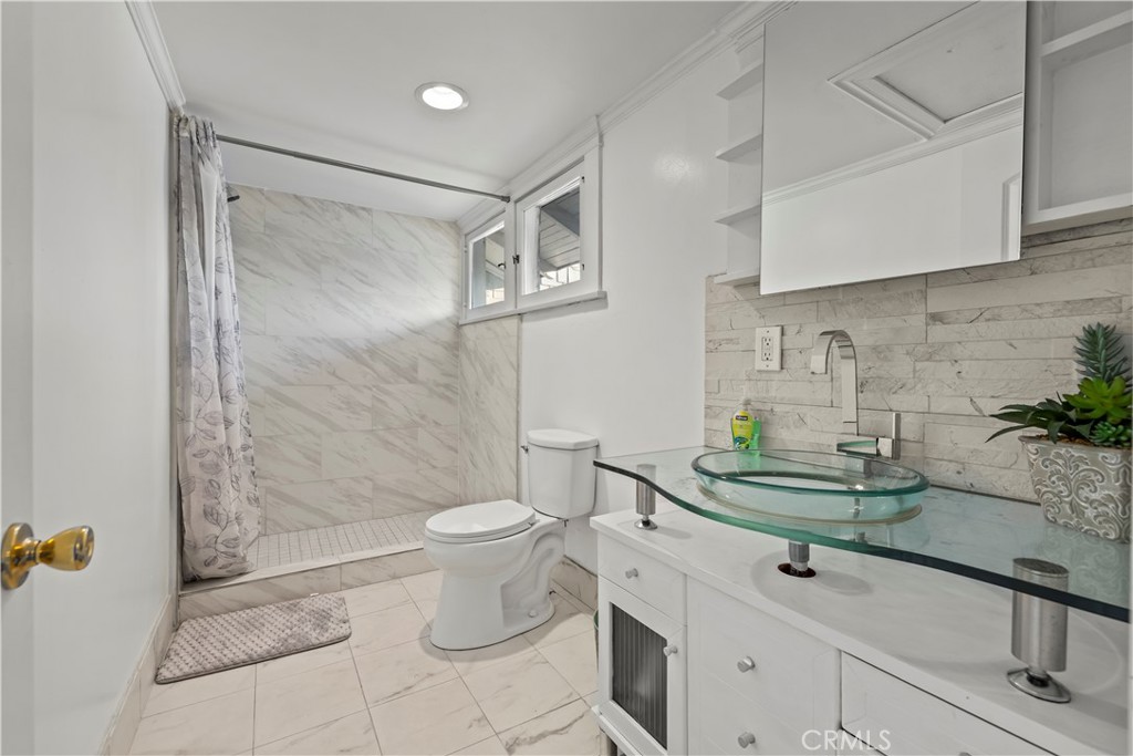 790 North El Molino Avenue Pasadena, CA 91104 - Photo 27 of 34 a bathroom with a sink a toilet and shower