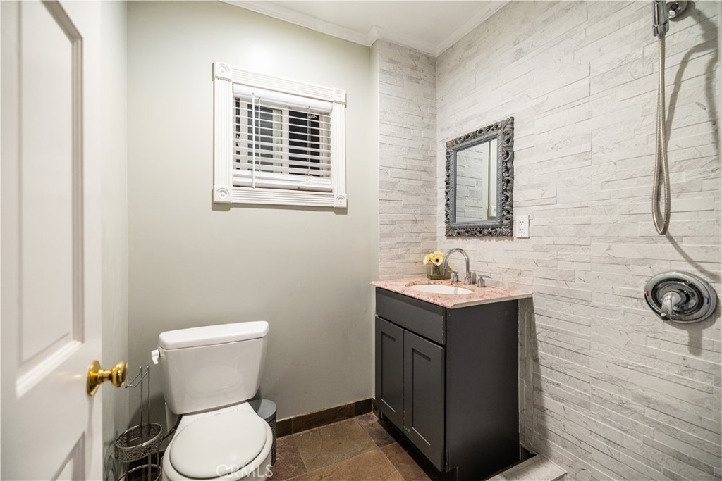 790 North El Molino Avenue Pasadena, CA 91104 - Photo 31 of 34 a bathroom with a sink toilet and a mirror