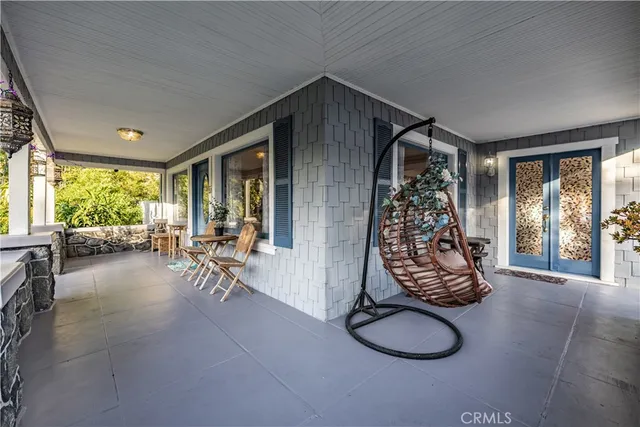 a living room with fireplace furniture and a wooden floor