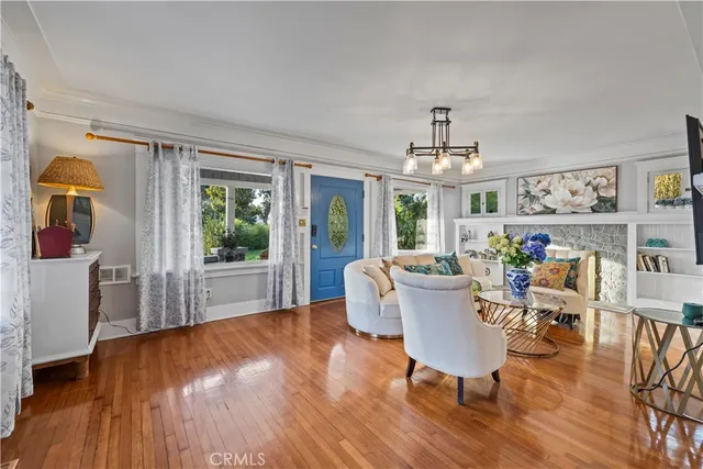 a bedroom with two beds and a large window