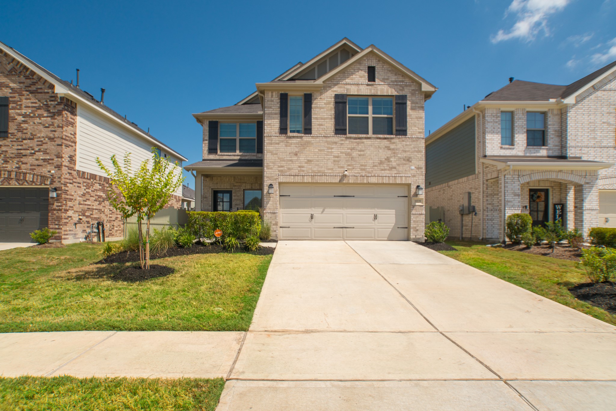10539 Preserve Way Conroe, TX 77385 - Photo 1 of 31 a front view of a house with a yard