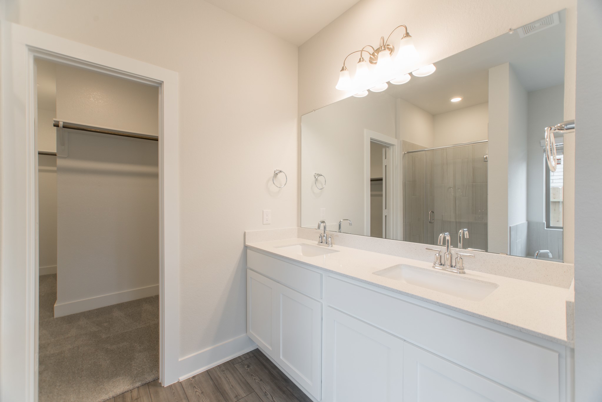 10539 Preserve Way Conroe, TX 77385 - Photo 16 of 31 a bathroom with a sink a light fixture and a mirror