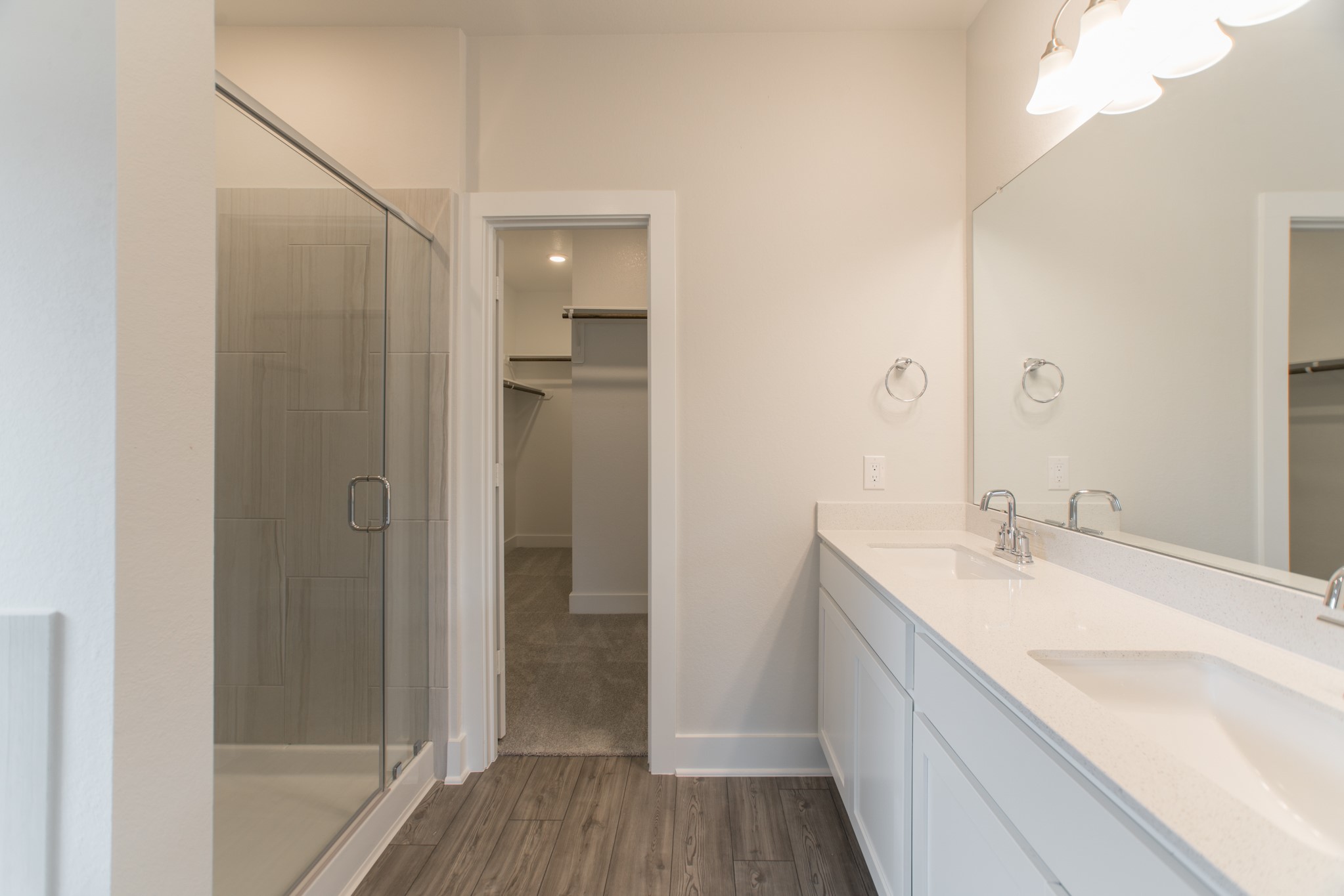 10539 Preserve Way Conroe, TX 77385 - Photo 17 of 31 a bathroom with a granite countertop sink mirror and shower