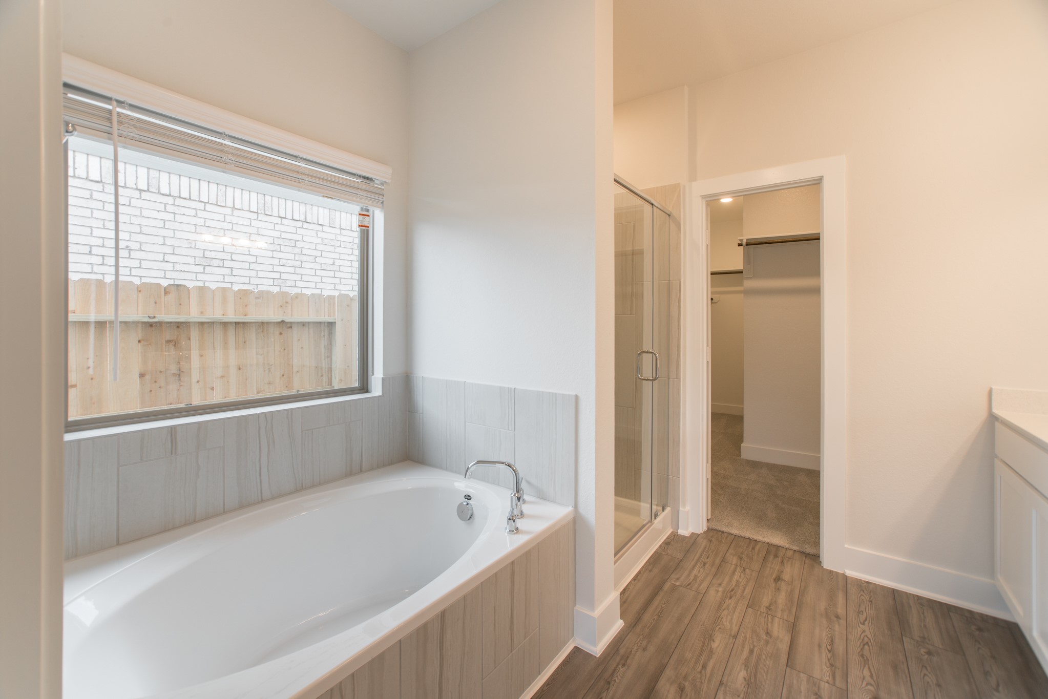 10539 Preserve Way Conroe, TX 77385 - Photo 18 of 31 a bathroom with a bathtub and a shower