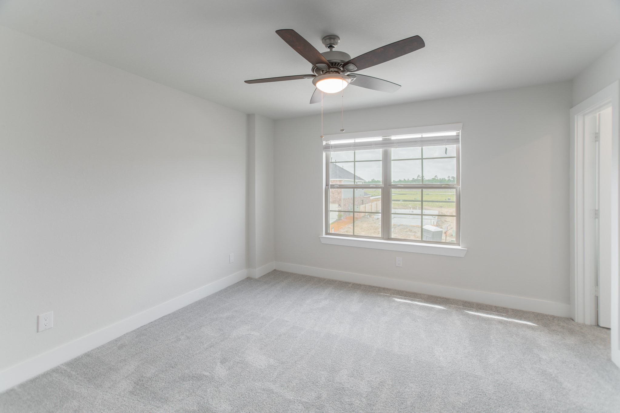 10539 Preserve Way Conroe, TX 77385 - Photo 25 of 31 an empty room with a window