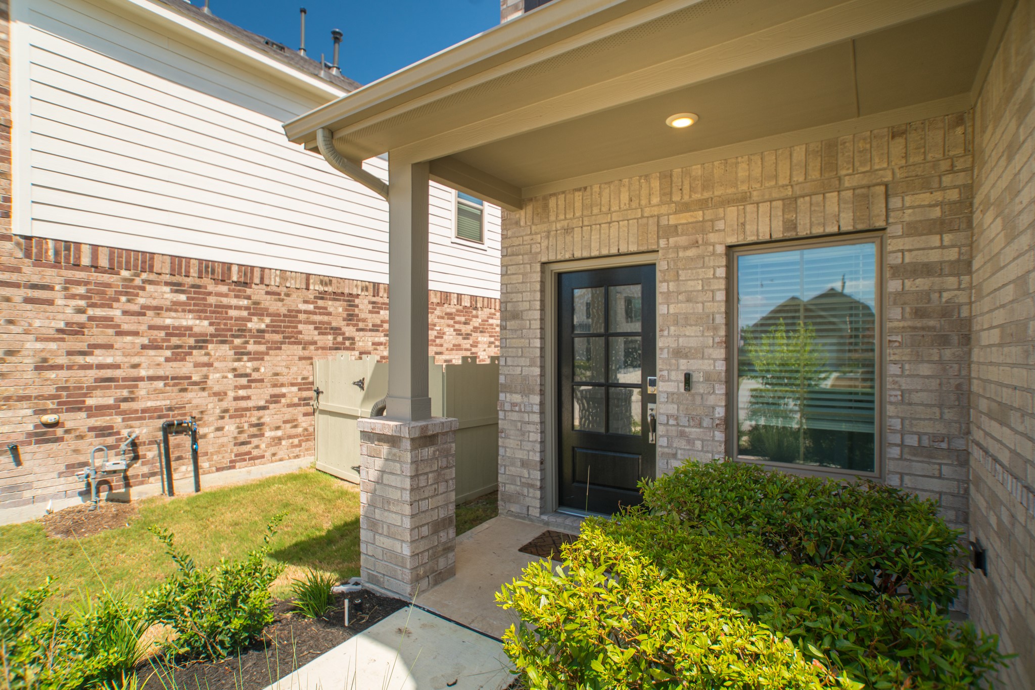 10539 Preserve Way Conroe, TX 77385 - Photo 3 of 31 a front view of a house with a garden