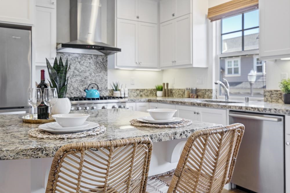 47236 Cavanaugh Common Fremont, CA 94539 - Photo 15 of 52 a kitchen with stainless steel appliances granite countertop a sink and a white cabinets