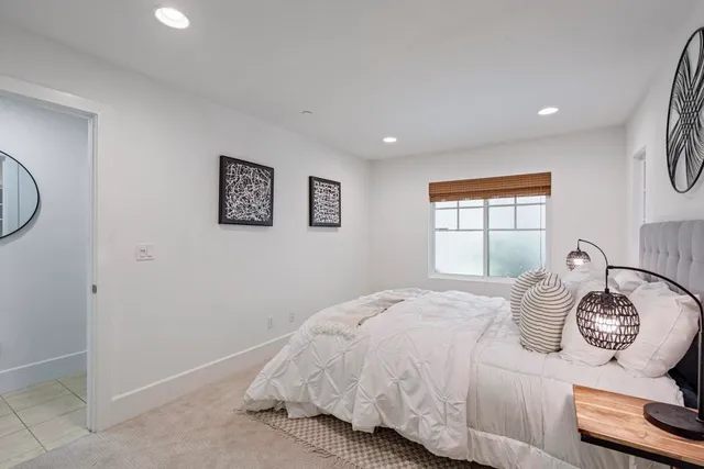 a bedroom with bed and a closet