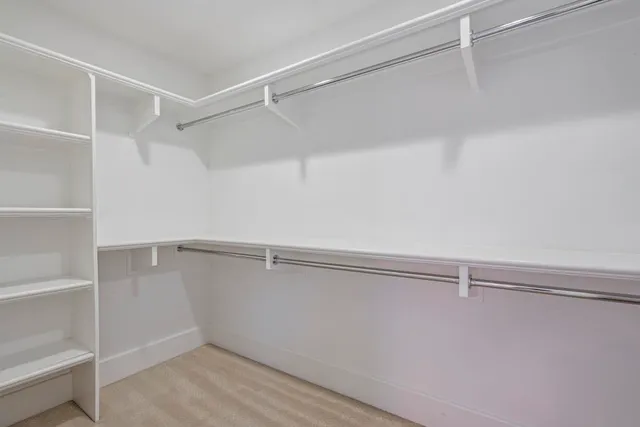 a bathroom with a granite countertop sink a shower and a mirror