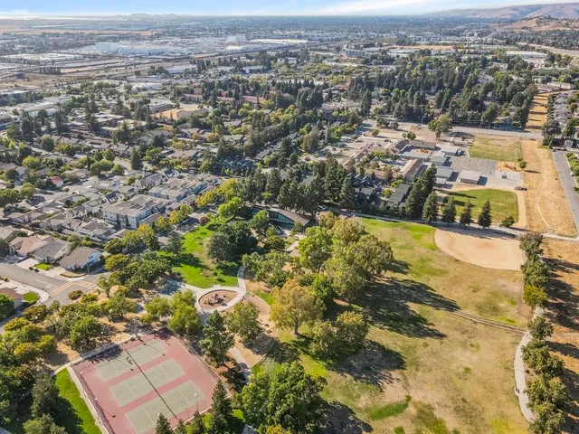 an aerial view of residential houses with outdoor space