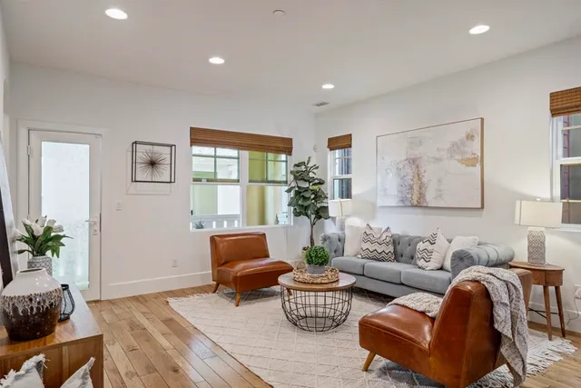 a kitchen with stainless steel appliances kitchen island granite countertop a stove refrigerator and cabinets
