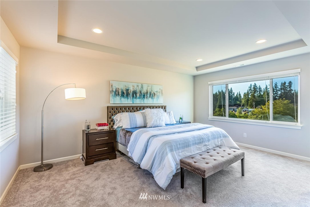 5638 Northeast 9th Street Renton, WA 98059 - Photo 17 of 40 a bedroom with a bed and a window
