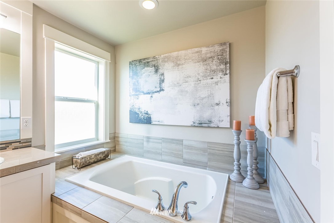 5638 Northeast 9th Street Renton, WA 98059 - Photo 24 of 40 a bathroom with a bathtub and a shower