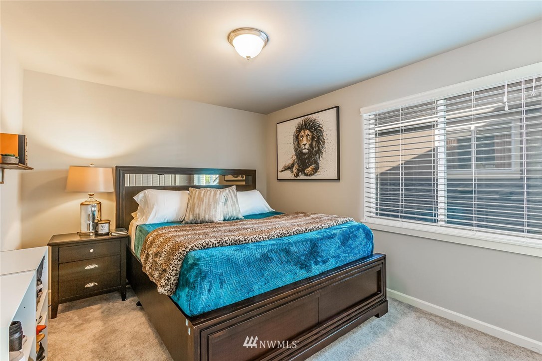 5638 Northeast 9th Street Renton, WA 98059 - Photo 25 of 40 a bedroom with a bed and window